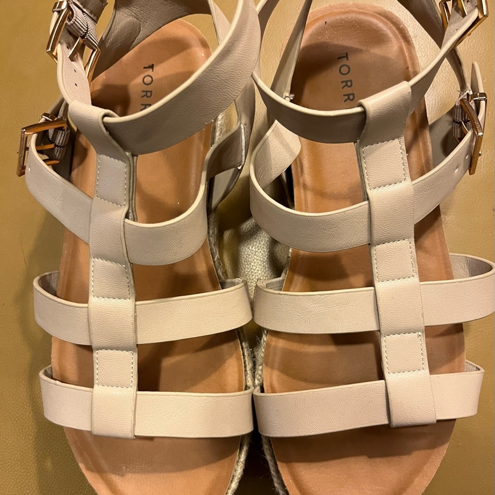 Torrid Cream Gladiator Sandals with Buckle Closure.
